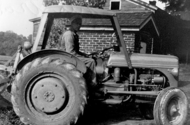 Raymond Glenister with his 1946 ford tractor